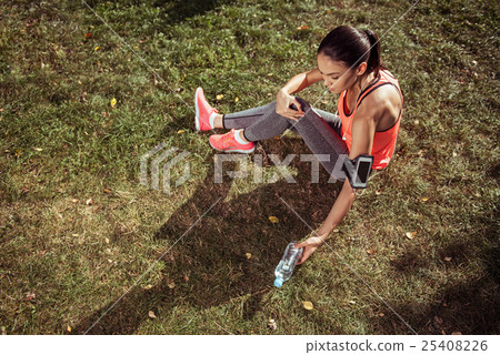 Young girl having rest after morning exercises Young girl having rest after morning exercises 25408226