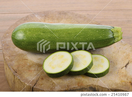 green zucchini vegetables on wooden background 25410987