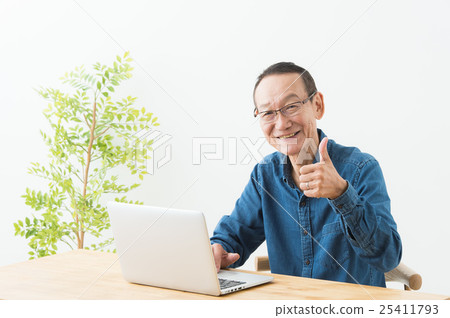 Male operating a personal computer (senior) Male operating a personal computer (senior) 25411793