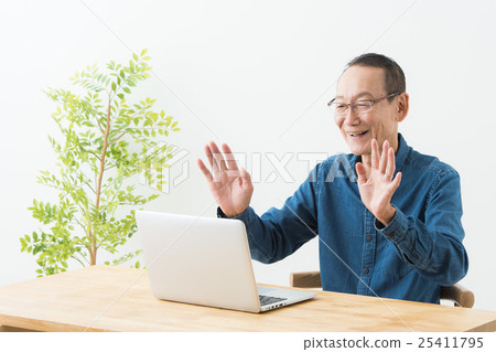 Male operating a personal computer (senior) Male operating a personal computer (senior) 25411795