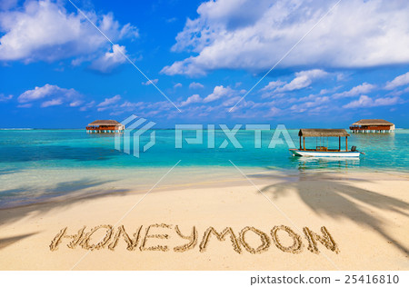 Word Honeymoon on beach 25416810