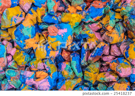 many stones in colorful paint abstract background 25418237