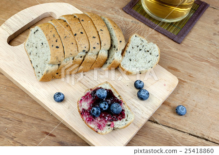 Vegetarian black sesame bread top blueberry jam 25418860