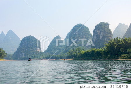 Karst rocks and Li River in Yangshou, China Karst rocks and Li River in Yangshou, China 25419746