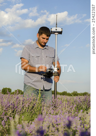 Geodesy measurement in a lavender field Geodesy measurement in a lavender field 25422387