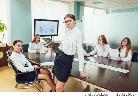 Beautiful business woman in glasses standing on Beautiful business woman in glasses standing on 25422693
