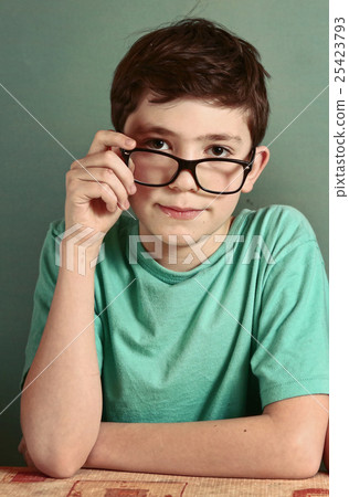 boy in myopia glasses close up photo boy in myopia glasses close up photo 25423793