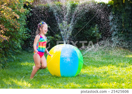 Little girl playing with water ball toy 25425606