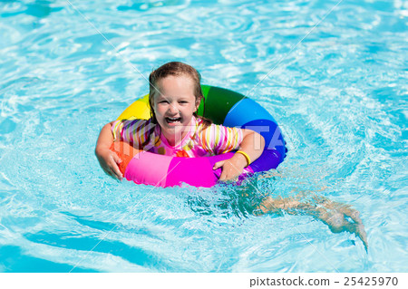 Little girl with toy ring in swimming pool Little girl with toy ring in swimming pool 25425970
