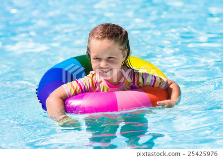 Little girl with toy ring in swimming pool Little girl with toy ring in swimming pool 25425976