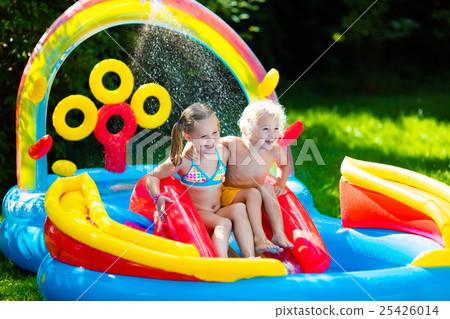 Kids playing in inflatable swimming pool Kids playing in inflatable swimming pool 25426014