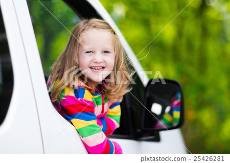 Little girl sitting in white car Little girl sitting in white car 25426281