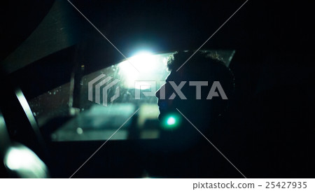 Profile of a man in  car on  dark night. 25427935