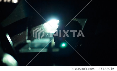 Profile of a man in  car on  dark night. 25428016