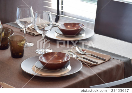 modern classic dining set on wooden dining table modern classic dining set on wooden dining table 25435627
