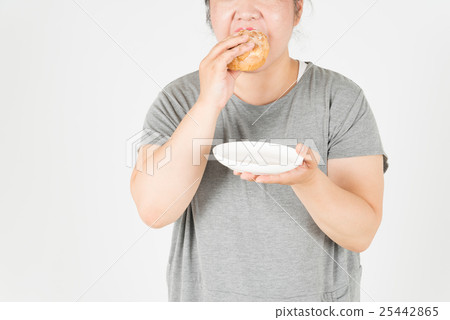 Fat woman eating cream puff 25442865