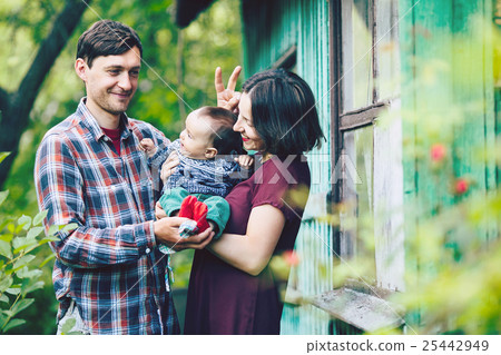 young family with a child on the nature young family with a child on the nature 25442949