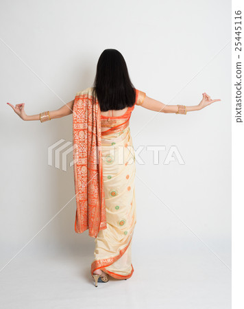 Rear view female in Indian sari dress dancing 25445116