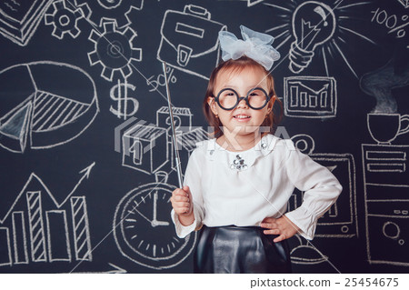 The little smart girl in glasses holding a pointer The little smart girl in glasses holding a pointer 25454675