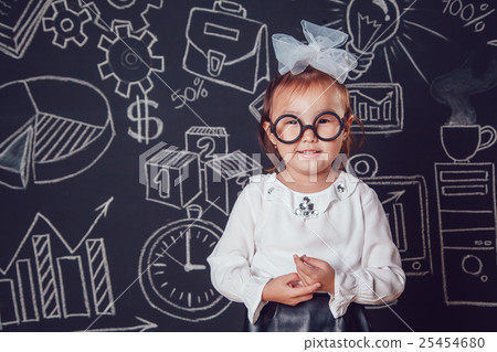 The little smart girl in glasses on a background The little smart girl in glasses on a background 25454680