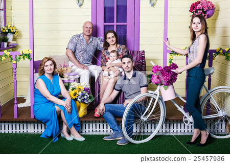 Happy big family sitting on porch 25457986