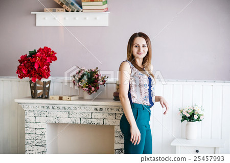 Young woman posing in the room 25457993