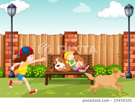 Girls playing with dogs in park 25459105