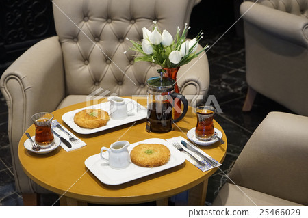 kettle, cups with tea and Eastern Turkish sweets kettle, cups with tea and Eastern Turkish sweets 25466029