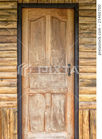 Wood door on the teak house wall Wood door on the teak house wall 25466700