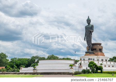 Buddha statue beside in decorated garden 25466707