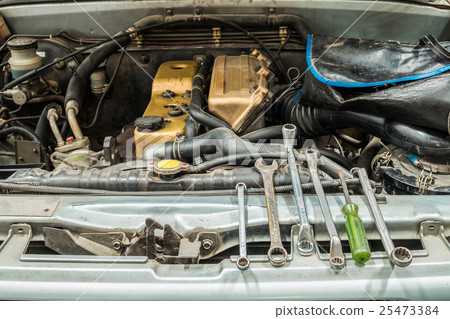 Car pick up old open engine with repair tools 25473384