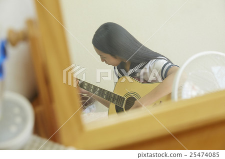 School girls playing the guitar 25474085