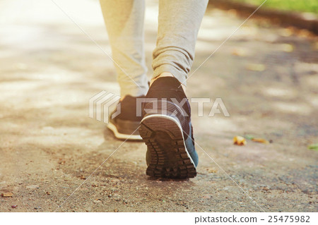 Closeup female running shoes on the feet 25475982