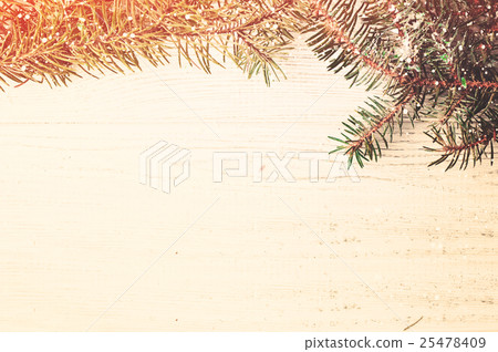 Christmas tree branches on wood background 25478409