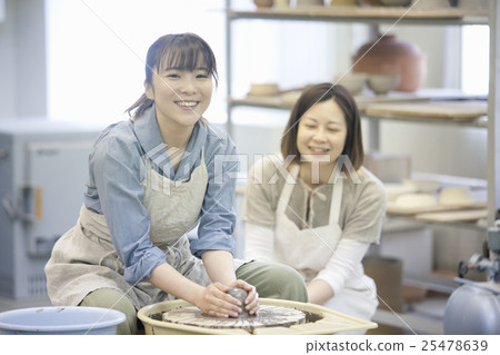 A woman doing ceramics A woman doing ceramics 25478639
