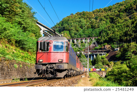 Freight train goes down the Gotthard pass - 25481249