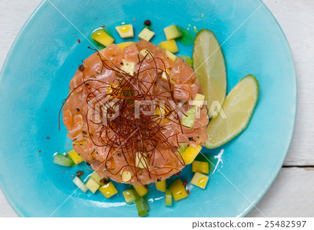 Tatar of salmon with avocado and mango 25482597