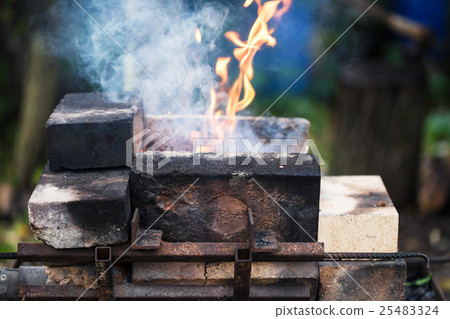 flame in outdoor rural brick forging furnace 25483324
