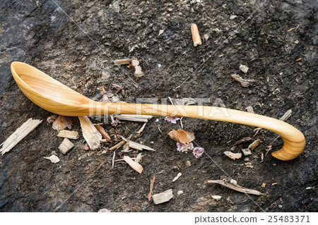 side view of wooden spoon carved from Alder wood side view of wooden spoon carved from Alder wood 25483371