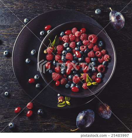 ceramic bowl with assortment berries 25483997