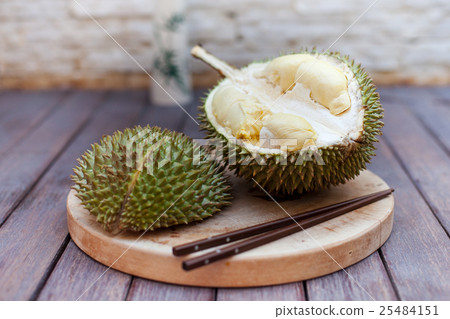 Durian fruit, Mon Thong on wooden cutting board Durian fruit, Mon Thong on wooden cutting board 25484151