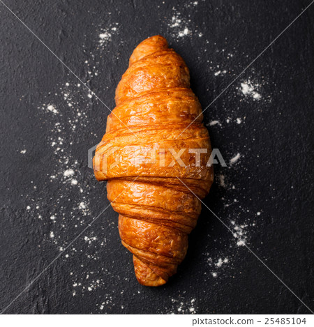Fresh croissant Black slate background. Top view 25485104