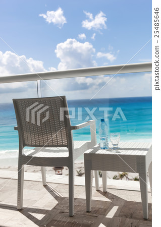 Balcony with plastic bottle of water on  table 25485646