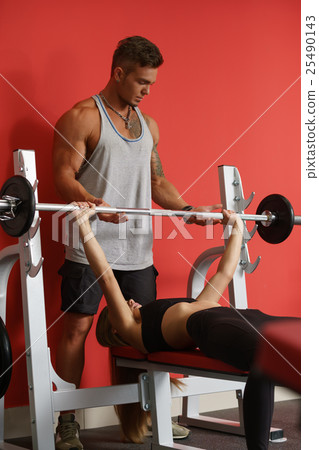 Girl asked trainer to spot her during workout Girl asked trainer to spot her during workout 25490143