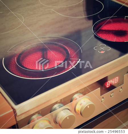 Electric ceramic stove inside the kitchen Electric ceramic stove inside the kitchen 25496553
