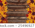 maple leaves and wooden background 25496927