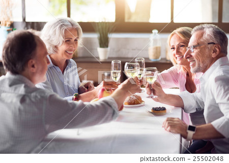Happy family drinking champagne Happy family drinking champagne 25502048