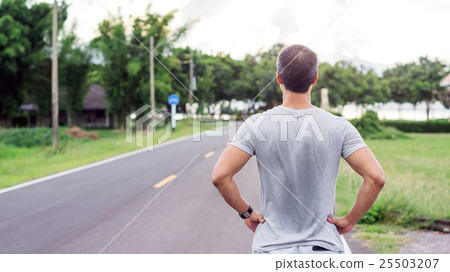 Asian man prepares for a workout at the public park, soft focus. Asian man prepares for a workout at the public park, soft focus. 25503207