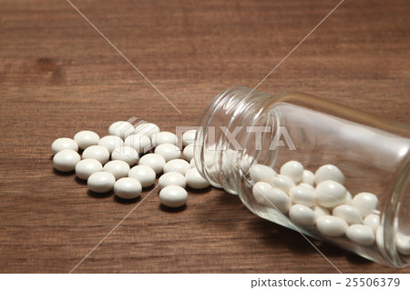 White medicine spilling from a collapsed transparent bottle White medicine spilling from a collapsed transparent bottle 25506379