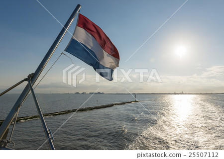Wadden Sea with Dutch flag 25507112